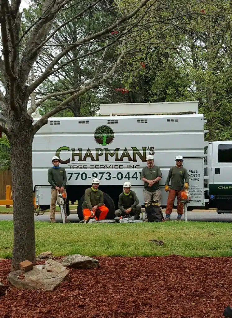 chapman workers standing in front of truck